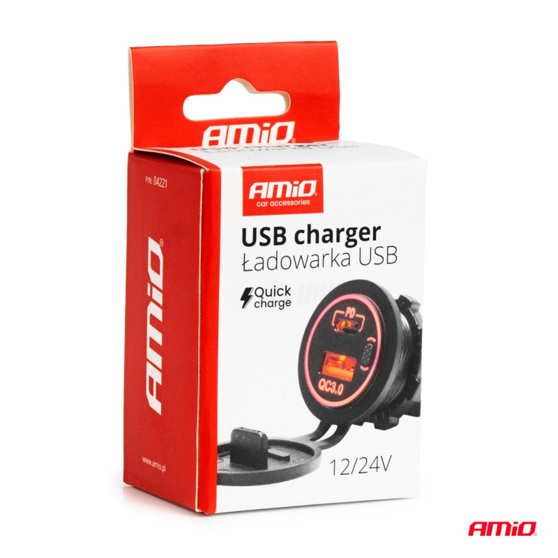 Charger with USB-C and USB sockets on red background Charger with USB-C and USB sockets on red background